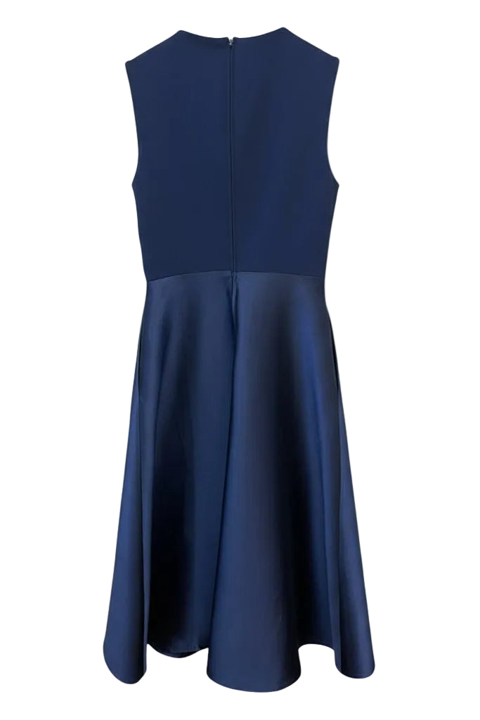 Back of a navy blue dress on a white background.