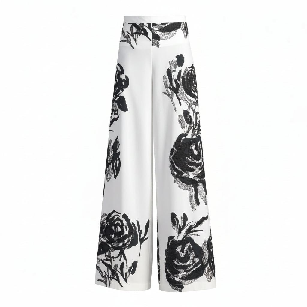 White pants with black floral pattern on a white background.