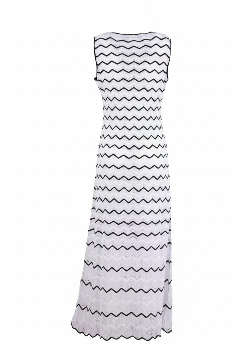 The back of a white dress with black zigzag pattern on a white background.